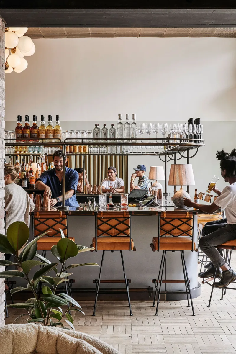 Interior still image of a bar and lounge for Hoxton Hotel Williamsburg by photographer Alan Jensen, represented by Pat Bates & Associates, a premier photo and artist agency in the hospitality and travel sectors.