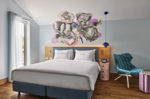 Turquoise and pink themed bedroom with wall art at the 25hours Hotel, The Olympia in Sydney Photographed by Alan Jensen, represented by Pat Bates & Associates, a leading artist agency in the hospitality and luxury lifestyle brand sector.