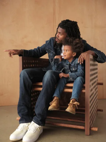 Still image of denim-clad father and son for Levi’s campaign. Set prop styling by Cecilia Elguero, represented by Pat Bates & Associates, a leading photography agency in the retail advertising sectors.