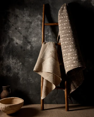 Interior still image of rugs for Dhongia x Kravet with prop styling by Elizabeth MacLennan, represented by Pat Bates & Associates, a premier photo and artist agency in the retail home decor sectors.