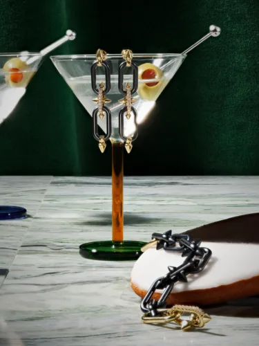 Luxury still life photograph of Tiffany & Co. jewellery styled with martini glasses and olives, photographed by Janelle Jones, represented by Pat Bates & Associates, for Travel + Leisure x Tiffany & Co.