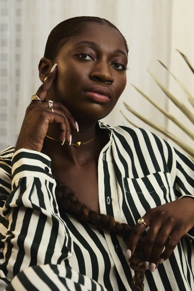 Lifestyle fashion still image of woman wearing jewelry for Desta by photographer Janelle Jones, represented by Pat Bates & Associates, a premier photo and artist agency in the lifestyle fashion sector.