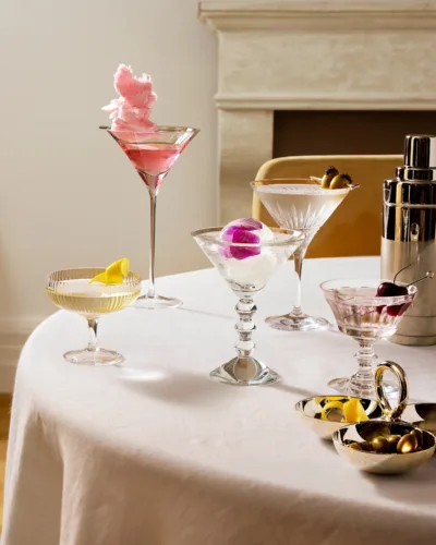 Still life image of holiday cocktails in a variety of glassware for Bloomingdales by photographer Kate S. Jordan.