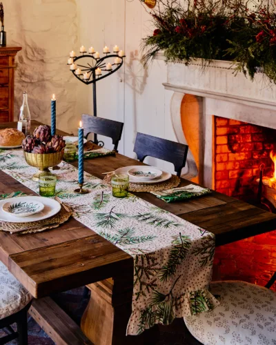 Interior still image of dining room set for holidays for Odette x GreenRow by photographer Kate Jordan, represented by Pat Bates & Associates, a premier photo agency in the retail lifestyle and home decor sectors.