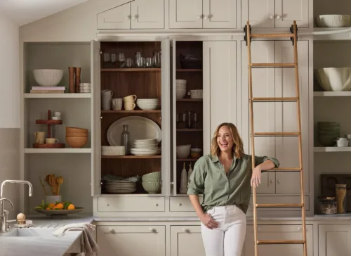 Lifestyle still image of influencer Gaby Dalkin with tableware for her partnerhip with Crate & Barrel with prop styling by Lynsey Fryers, represented by Pat Bates & Associates, a premier photo and artist agency in the retail home brands sector.
