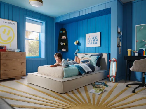 Lifestyle interior still image of boy's bedroom for West Elm Kids with prop styling by Naomi deManana, represented by Pat Bates & Associates, a premier photo and artist agency in the retail home and kids home brand sectors.