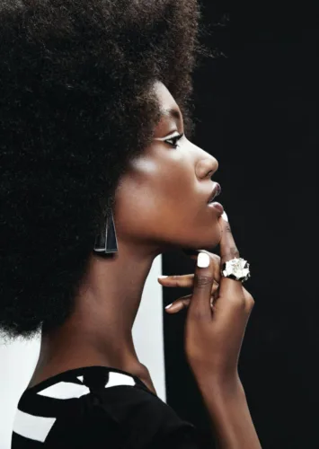 Still image of woman with opaque black and white eye makeup with hair and makeup by hmu artist Paul Fields, represented by Pat Bates & Associates, a premier agency in the lifestyle, editorial and beauty brand sectors.