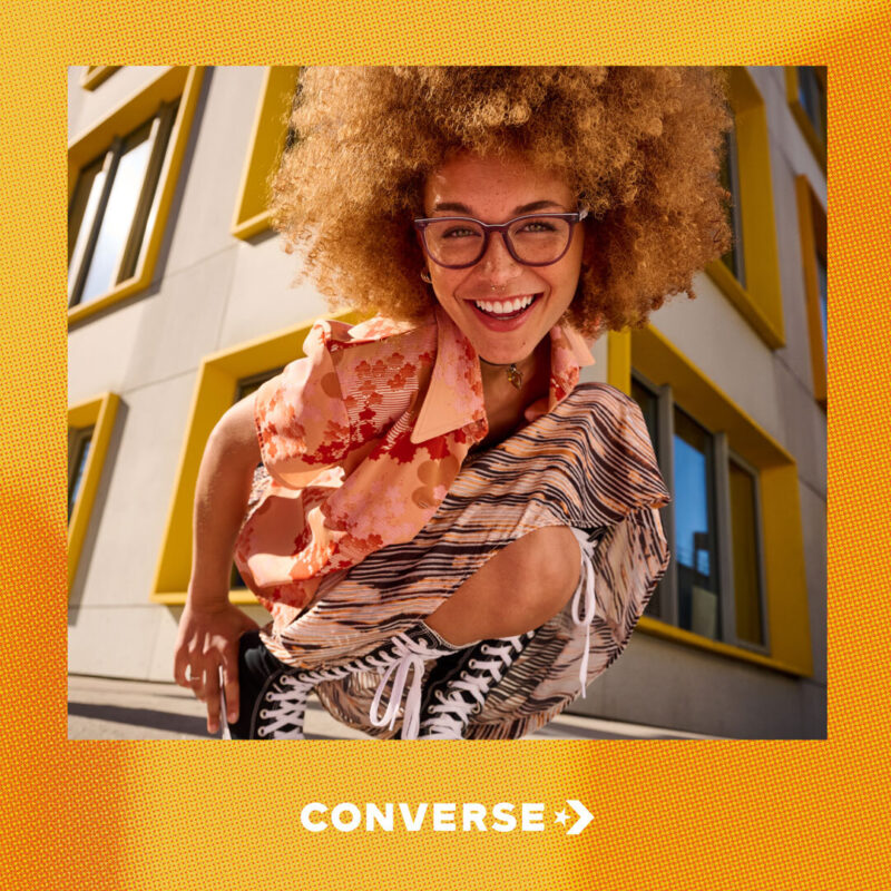 Lifestyle fashion still image of young adult woman for Converse Eyewear with hair and makeup by hmu artist Paul Fields, represented by Pat Bates & Associates, a leading photo agency in the lifestyle fashion and accessories retail advertising sectors.